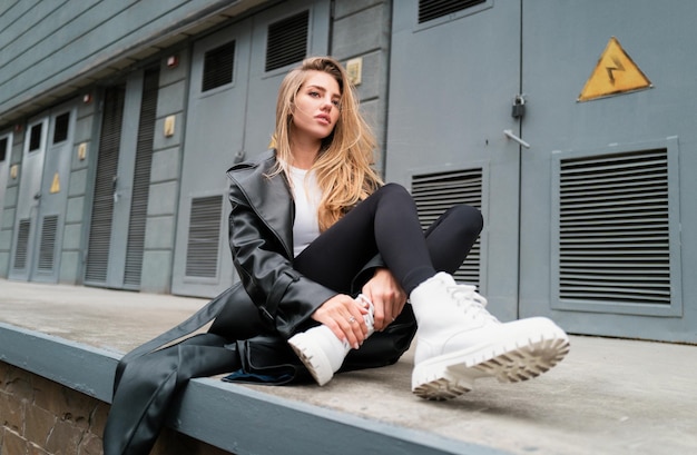 Beautiful female model in summer city in Europe Trendy woman posing on the street background Fashion model girl feeling sad angry and upset outdoor Urban vogue girl