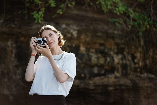 Beautiful female photographer on the beach