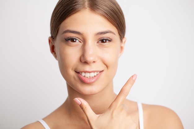 Beautiful female smile after teeth whitening procedure