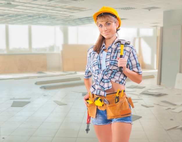 Beautiful female worker on construction site