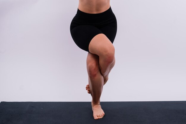 Beautiful female in yoga studio A woman doing a yoga Lady in a top