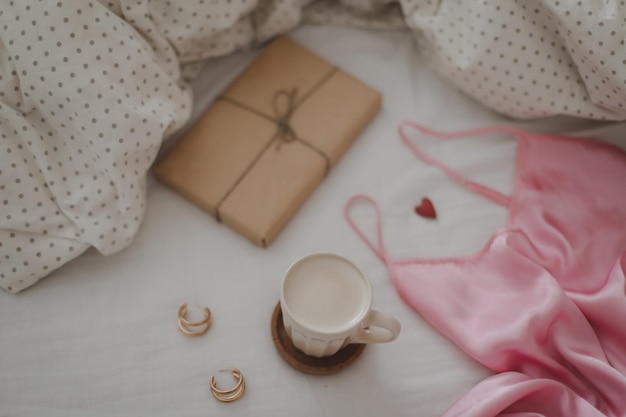 Beautiful feminine flatlay frame arrangement with lingerie coffee cup jewerly and accessories