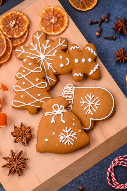 Beautiful festive Christmas composition of tangerines gingerbread and star anise