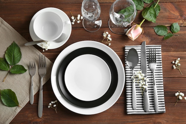 Beautiful festive table setting on wooden table