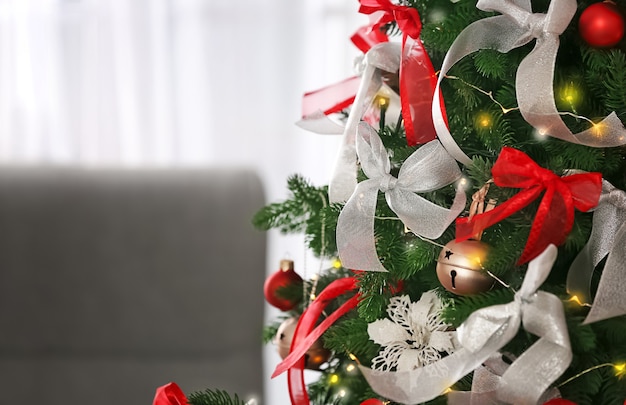 Beautiful fir tree decorated for Christmas, closeup