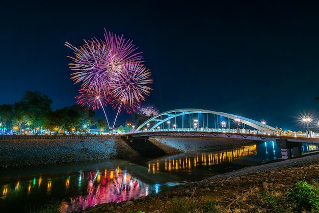 Beautiful Fireworks and light Chan Palace Bridge over the Nan River New Landmark It is a major tourist is Public places attraction PhitsanulokThailandTwilight sunset