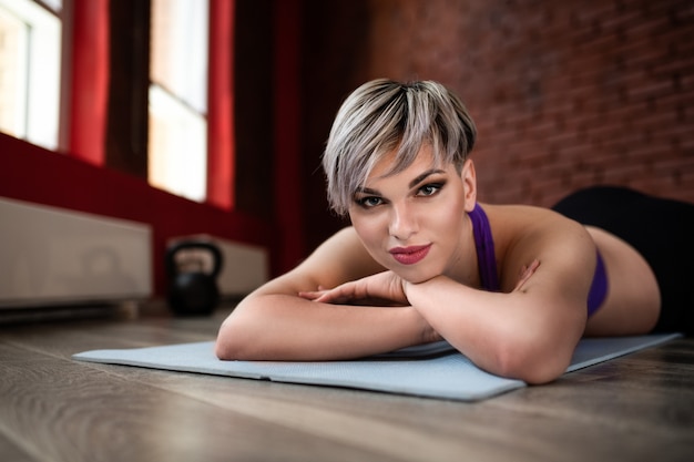 Beautiful fitness model girl posing wearing sport clothes. Girl in the sport concept. Portrait close up