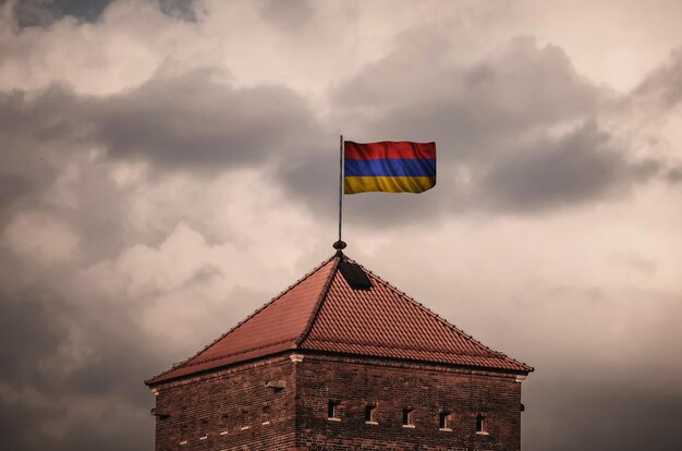 Beautiful flailing flag on the roof of the old fortress