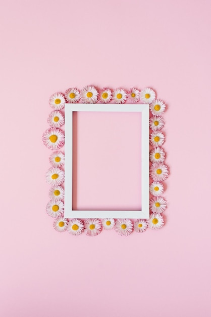 beautiful floral arrangement an empty text frame daisy flowers on a pastel pink background valentine's day easter birthday happy women's day mother's day flat lay top view copy space