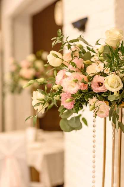 Beautiful floral compositions in the restaurant for the wedding ceremony