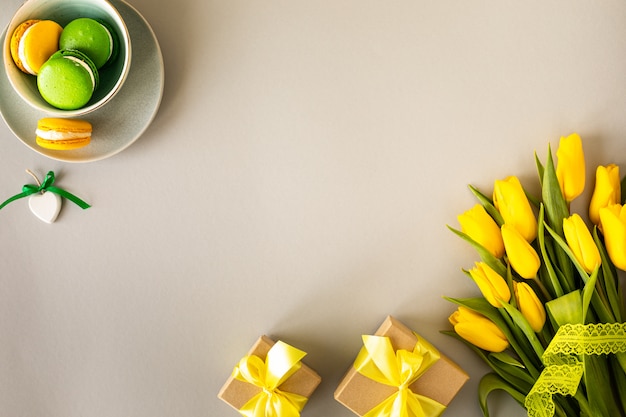 Beautiful flower arrangement. yellow flowers tulips, empty frame for text on a white background. wedding. birthday valentine's day. mothers day. flat lay, top view, copy space