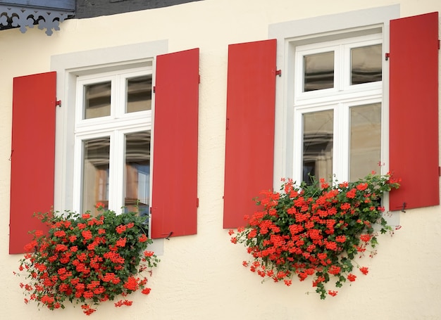 Beautiful flower baskets beneath windows in Rothenburg