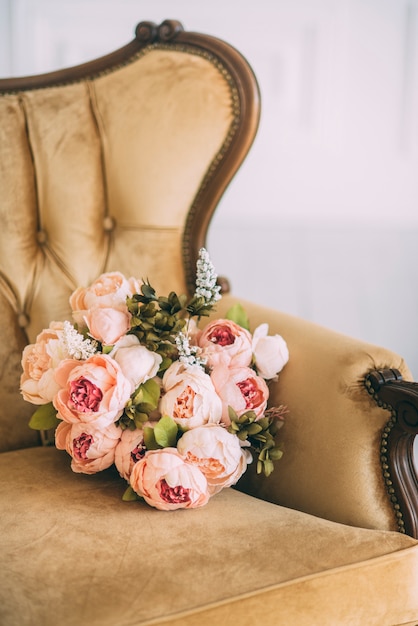 Beautiful flower bouquet on the sofa closeup vertical