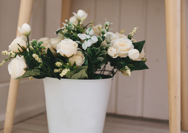 Beautiful flower bouquet in white basket