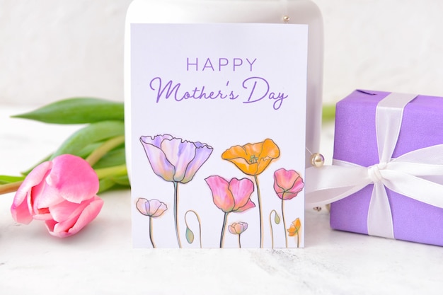 Beautiful flowers, gift and greeting card for Mother's Day on grey