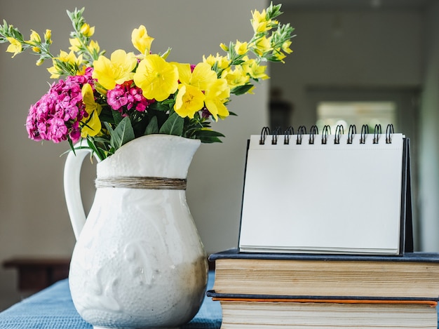 Beautiful flowers lying on a wooden table