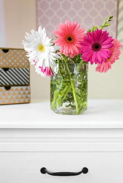 Beautiful flowers in vase on table