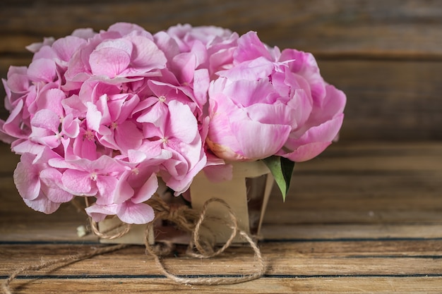 beautiful flowers on wooden table