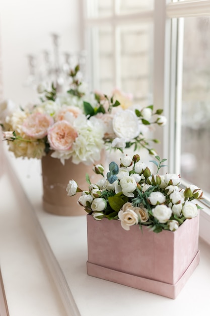 Beautiful flowers on wooden windowsill