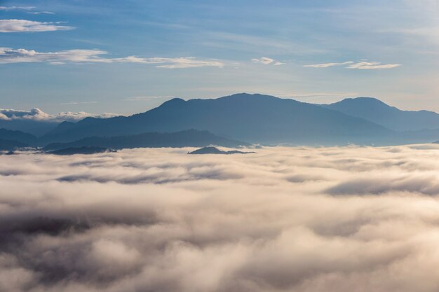 Beautiful flowing clouds and the mist in front of the mountains at Khao Khai Nui in sunrise time, Phang-Nga Province, Thailand