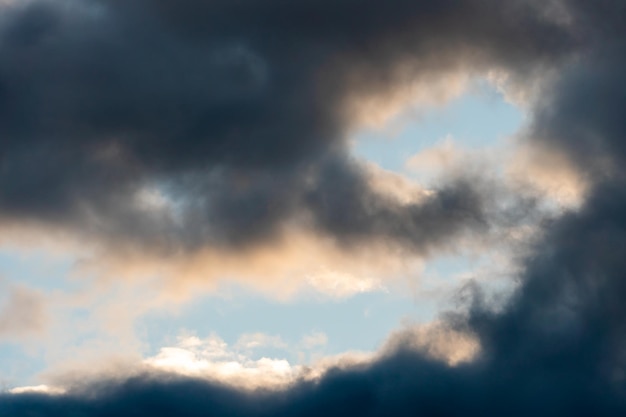 Beautiful fluffy clouds in the evening sky The sunlight gives a side light on the clouds Clouds before rain