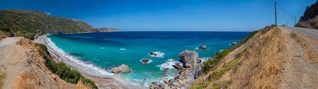 Beautiful foamy waves on the beach in Aegean sea in Greece