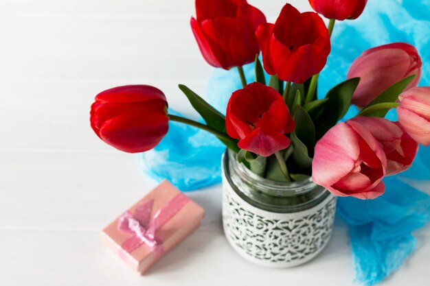 Beautiful fresh pink and red tulips of flowers in a vase.