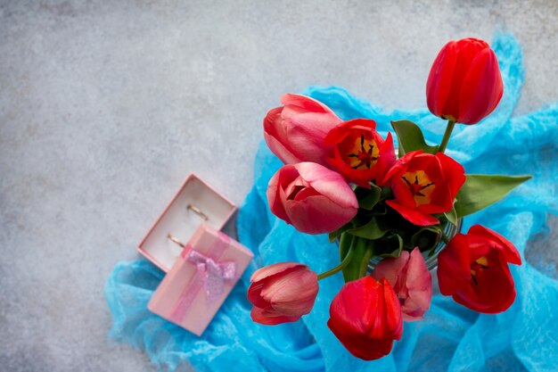 Beautiful fresh pink and red tulips of flowers in a vase.