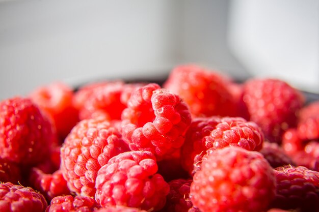 Beautiful freshly picked garden raspberries in the summer summer berries natural food