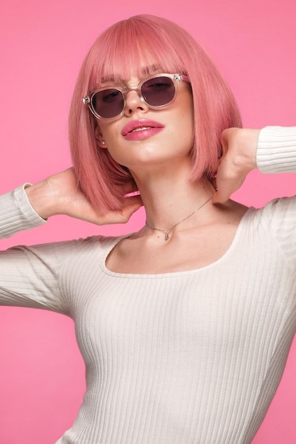 Beautiful funny cute woman in pink wig and classic makeup Beauty face