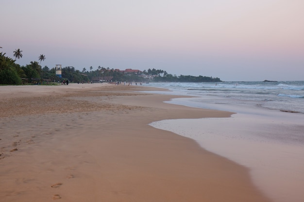 Beautiful gentle pink sunset by the ocean