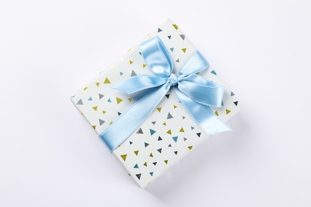 Beautiful gift box with bow on white background, space for text