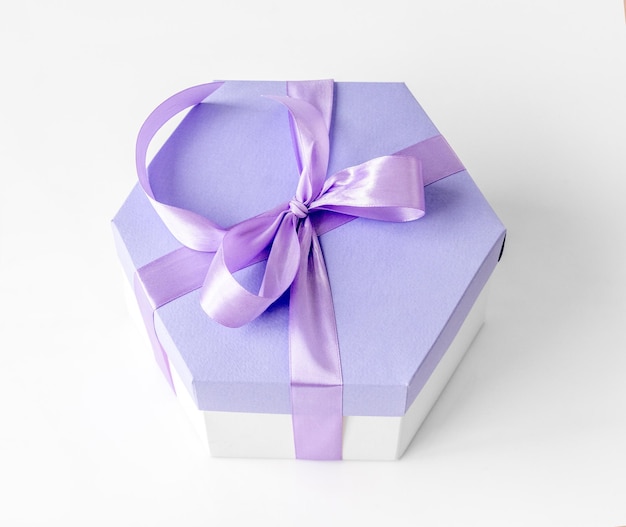 Beautiful gift box with lavander ribbon for celebration Romantic present package from above view