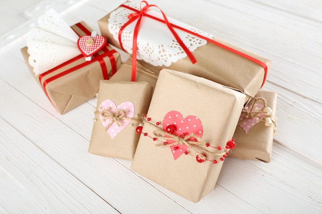 Beautiful gift boxes on wooden background. Valentine Day concept