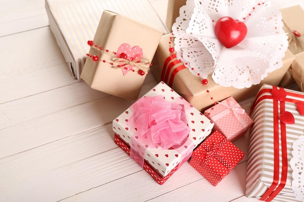 Beautiful gift boxes on wooden background. Valentine Day concept