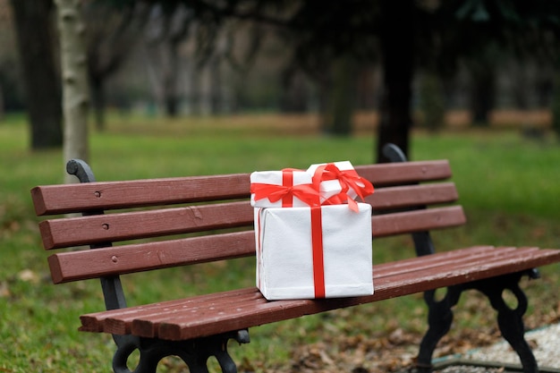 Beautiful gift New Year's decor Preparation for the holiday New Year's gifts on the wooden bench