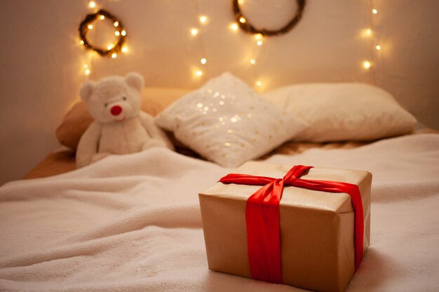 beautiful gift on the side and a toy bear. home delivery gift.