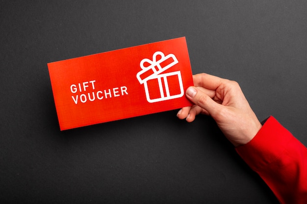 Photo beautiful gift voucher with hand