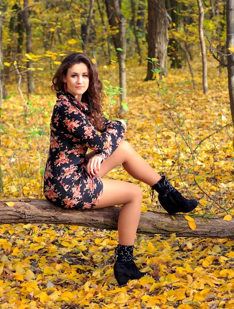 Beautiful girl in autumn park