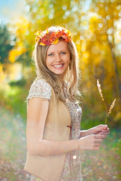 Beautiful girl in autumn wood