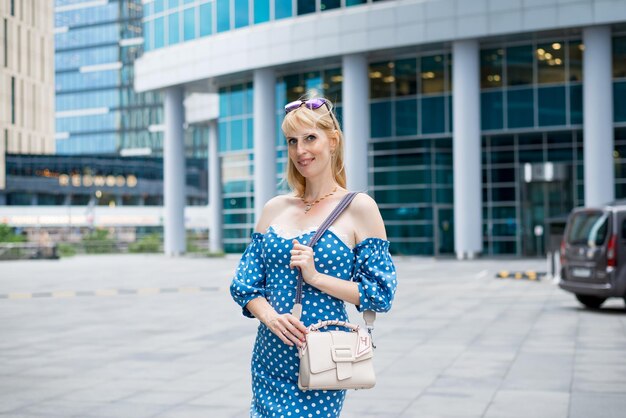 Beautiful girl on the background of the business center