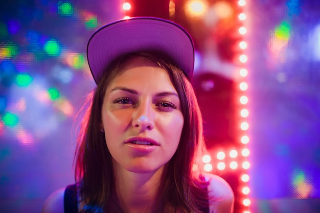 Beautiful girl on a background of night illumination in asia