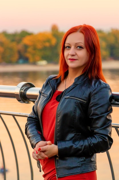 Beautiful girl on the background of the river