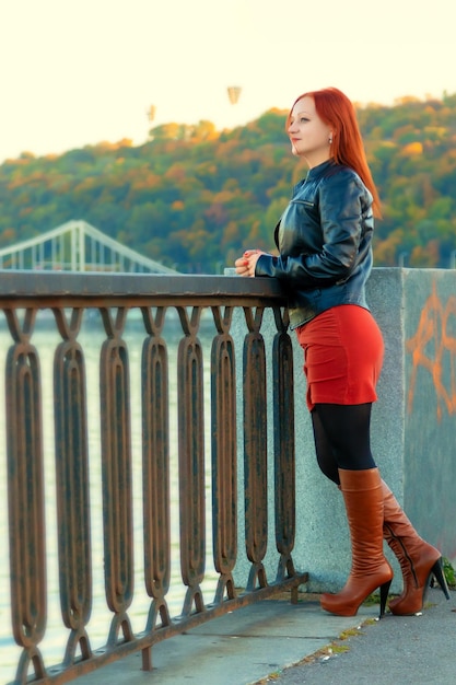 Beautiful girl on the background of the river