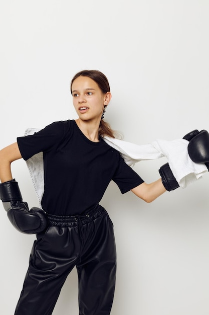 Beautiful girl in boxing gloves in black pants and a Tshirt Lifestyle unaltered
