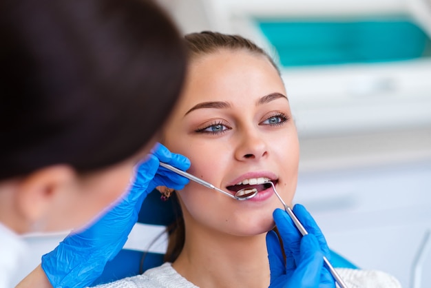 Beautiful girl on consultation with a dentist