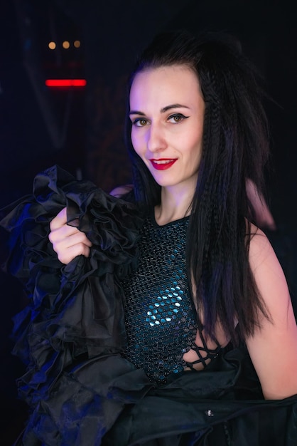 Beautiful girl dancer posing on the stage of a nightclub Party concept