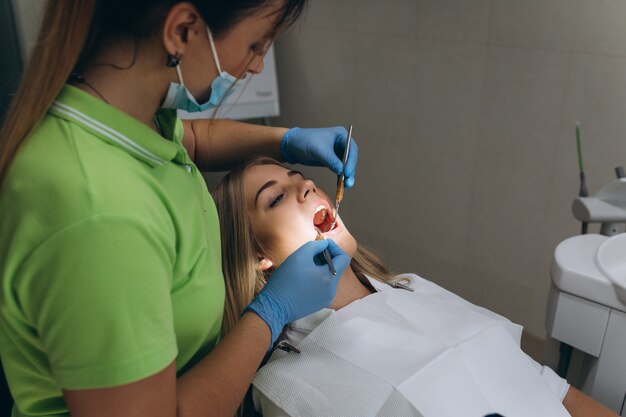 Beautiful girl at a dentist's review in a dental clinic.