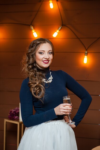 Beautiful girl drinking champagne