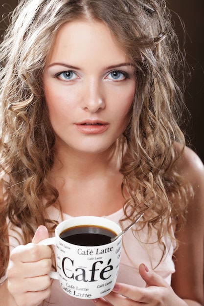 Beautiful Girl Drinking Tea or Coffee.